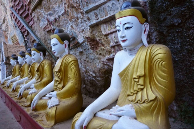 A row of Buddha Images before the entrance